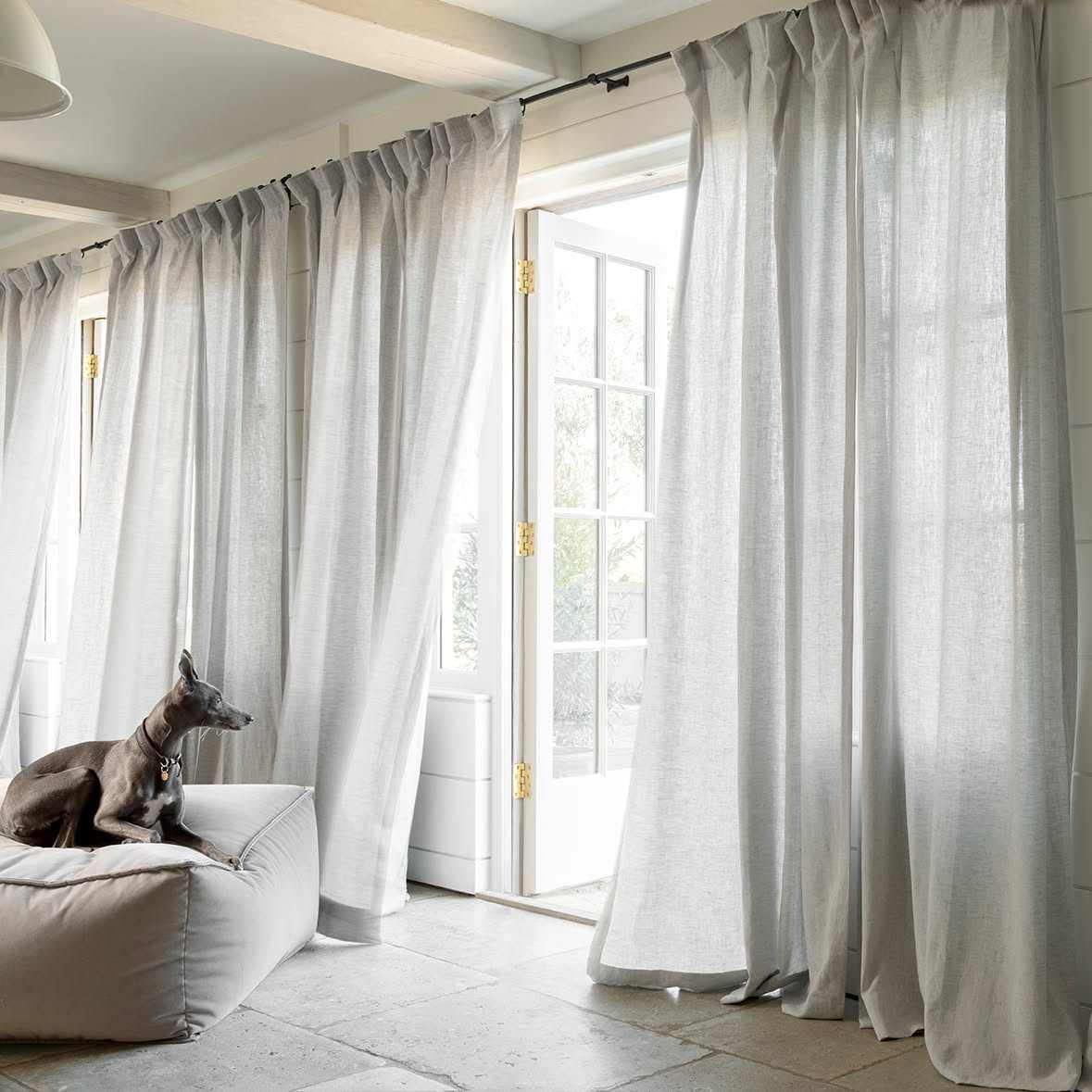 Sheer linen curtains with the daylight coming through them