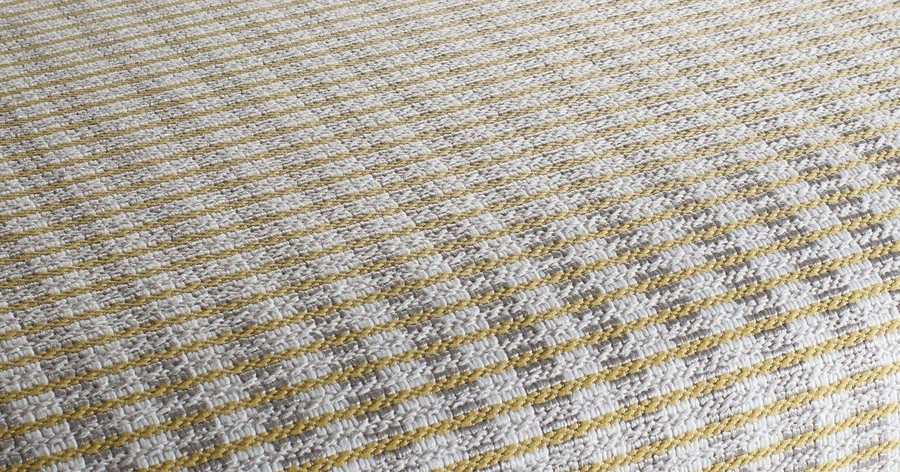 A textured weave fabric sample laid flat
